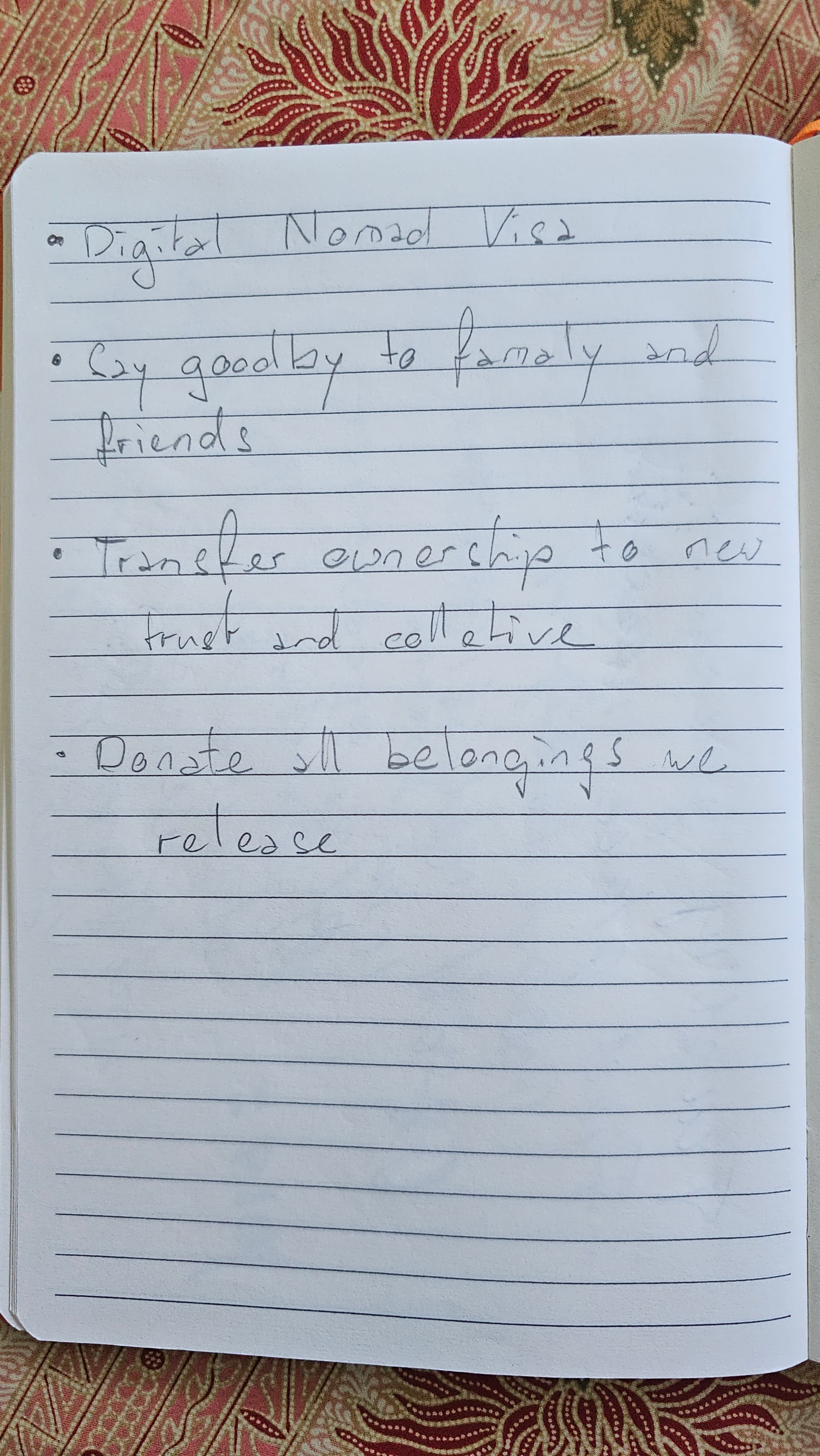 Notebook page listing four bullets: Digital Nomad Visa, Cry goodbye to family and friends, Transfer ownership to new trust and collective, Donate all belongings — release.